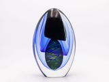 a glass vase with a blue and green design on it
