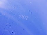 water drops on a blue surface with the word hope written on it