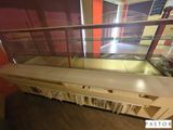 a glass display case in the middle of a room