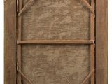 an old wooden frame with a picture hanging on the wall
