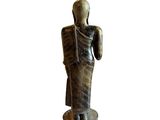 an image of a statue of a man holding a sword