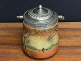 a small jar with a lid sitting on a wooden table