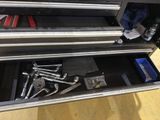 a tool drawer with tools in it on the floor