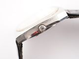 an image of a close up of a watch on a white surface