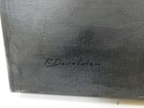 a close up of a painting of a black box with writing on it