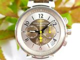 a close up of a wrist watch with a brown leather strap
