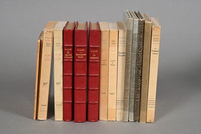 several books are stacked on top of each other on a table