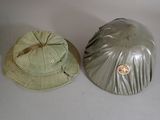 two hats that are sitting next to each other on a table