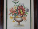 peinture représentant un vase contenant des fleurs, accrochée au mur