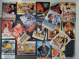 many movie posters on the wall of a room