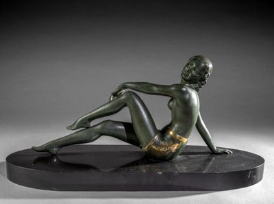 bronze sculpture of a woman sitting on a black base