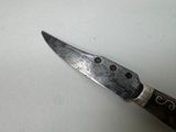a knife that is sitting on a table