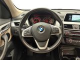 the interior of a bmw car with a steering wheel and dashboard controls