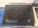 an image of a speaker in a box on a table
