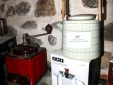 a tea kettle sitting on top of a box in a kitchen