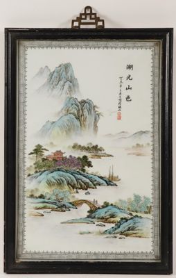 an old chinese painting hanging on a wall next to a wall