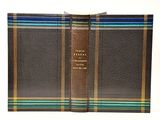 an image of a brown and blue plaid wallet on a white background