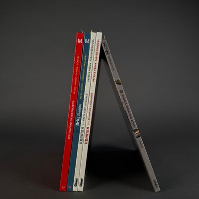 two books stacked on top of each other on a table