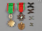 an assortment of medals including a star, a medal, and other items