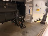 a machine that is sitting on the ground in the garage