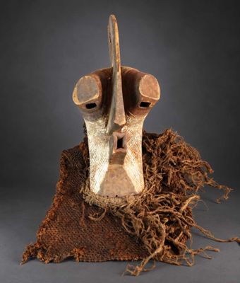 a close up of a mask on a piece of cloth