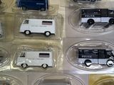 many different types of toy cars in the display case
