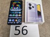 une boîte de Redmi Note 14 et une boîte blanche de Redmi Note 14