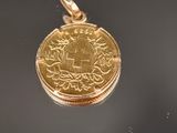 une image représentant une pièce d'or sur laquelle figure l'effigie d'un navire