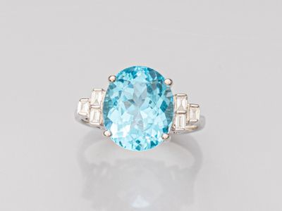 an oval blue topaze and diamond ring