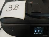 a printer that has a piece of paper on top of it