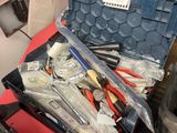 many tools in a tool box on a table