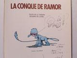 un livre ouvert sur lequel est dessiné un dinosaure