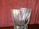 a glass vase that is sitting on a table