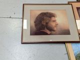 a picture of a man with a beard and a picture of a man with a beard hanging on a wall
