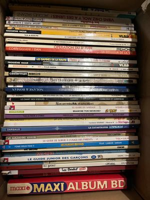 a lot of books in the box on the shelf