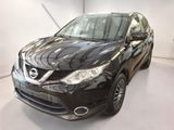 the black nissan murano is parked in a white room