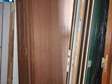 many pieces of wood in a room that is under construction