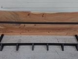 a bench made out of a piece of wood and metal