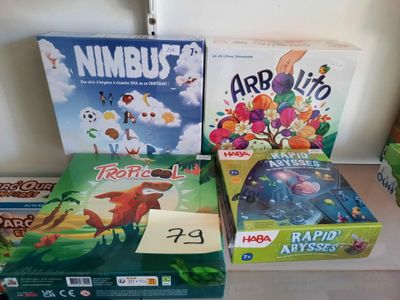 several board games are sitting on a table next to each other