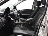 the interior of a car with black leather seats and a steering wheel