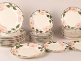 a lot of plates that are sitting on a table