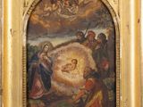 painting of the nativity of jesus in a golden frame