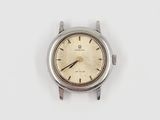 a close up of a watch on a white surface with a white background