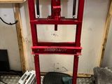 a red machine that is sitting in the corner of a room