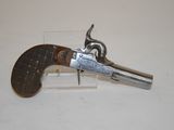 an old gun that is sitting on top of a table