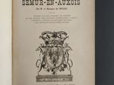 an old book with a coat of arms and a crown on it
