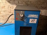 a blue machine that is sitting in a room