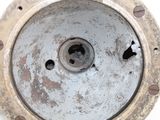 a close up of a metal object on a white surface