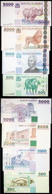 quatre billets différents, de couleurs et de formes variées, sur fond noir
