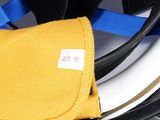 a helmet with a yellow bag on top of it